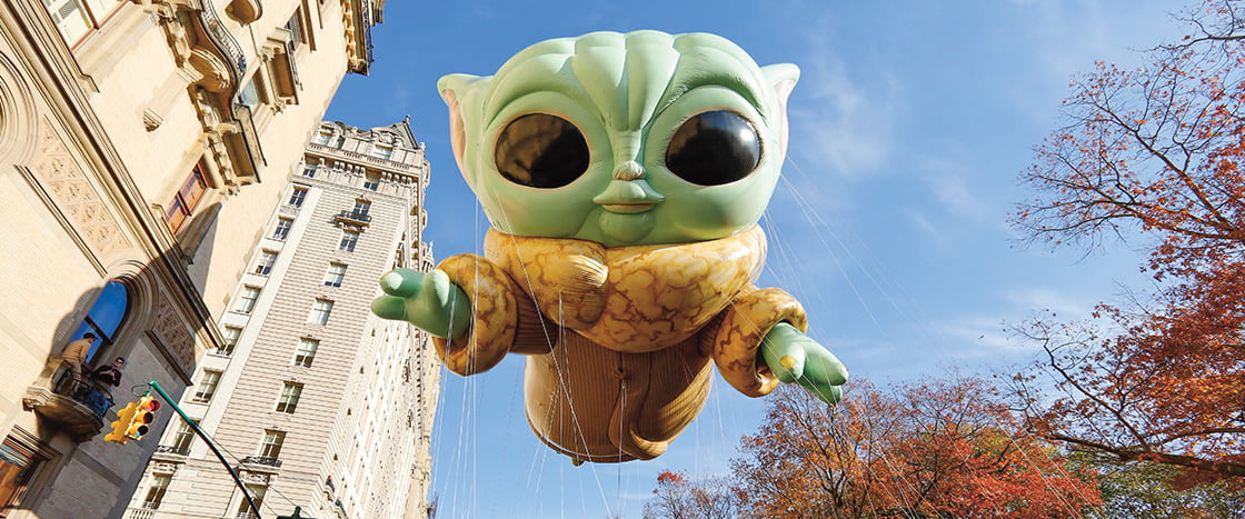 Image of a baby yoda float in a parade