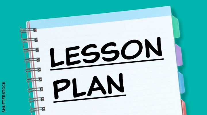 The words Lesson Plan written on a spiral notebook with tabbed dividers
